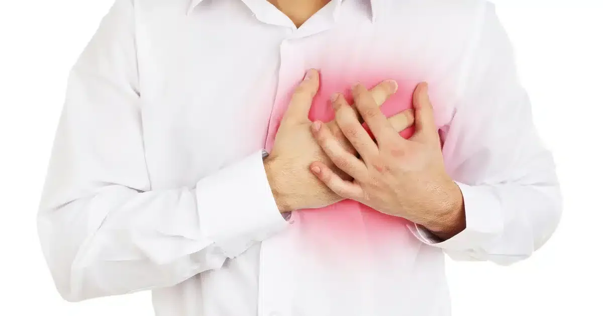 Man clutching his chest in pain